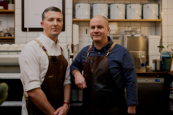 Bowen and Pip in Patricia Coffee Brewers, wearing Wootten leather aprons
