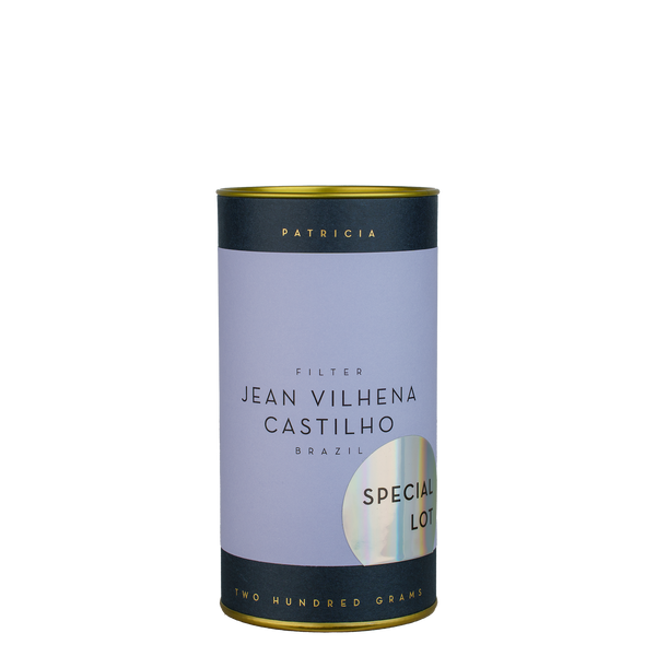 A navy blue cylinder with a purple label describes the roasted coffee beans within. 'PATRICIA' and 'TWO HUNDRED GRAMS' are printed in gold foil. A shiny round sticker reads 'SPECIAL LOT'