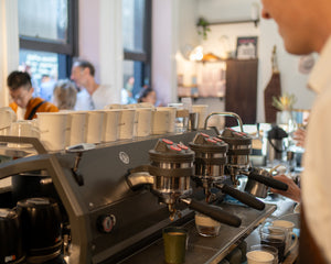 La Marzocco espresso machine with multiple cups on a busy morning at Patricia