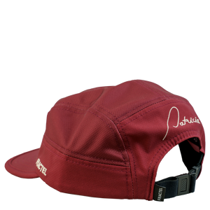 The back of a dark red running cap with the Patricia logo embroidered in pink on the back, and Fractel on the left panel.