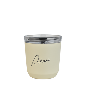 A cream coloured Kinto 240ml reusable coffee tumbler, with the Patricia logo printed in black on the front of it for your to-go coffee needs.