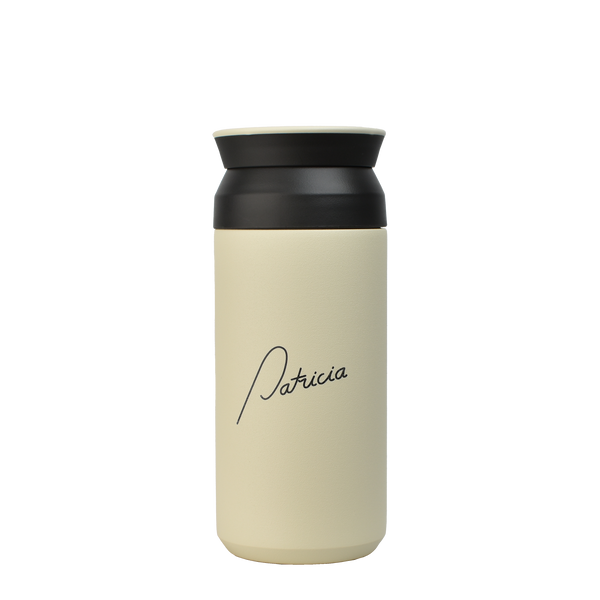 A cream coloured Kinto 350ml Tumbler with the Patricia logo printed in black on the front.