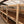 Raised wooden beds honey processing coffee, inside a purpose-built shed