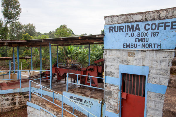 Rurima Coffee washing station with machinery and signboard in Embu, Kenya