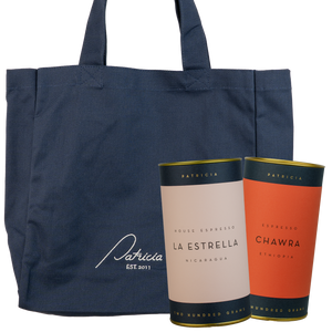 Navy tote bag with two coffee tins branded with 'Patricia'
