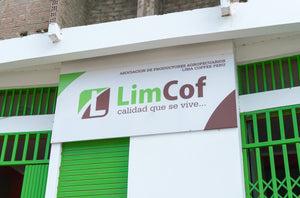 Building with a LimCof sign on a white background