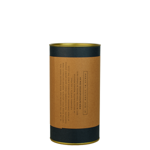 Dark blue cylinder with a brown label describing the decaf espresso coffee beans within.