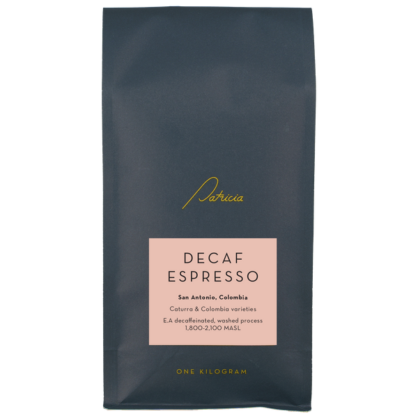 Decaf Espresso coffee package with 'Patricia' branding on a pink background
