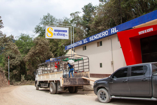 A truck is being loaded at the El Sendero Co-op in Concepción Huista, Huehuetenango, Guatemala.