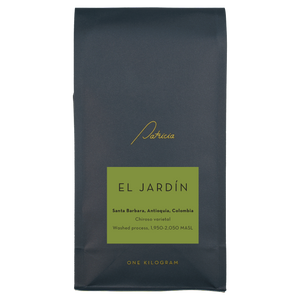 Navy blue recyclable coffee bag, with the Patricia logo in gold. It has a green label that reads 'El Jardín'.