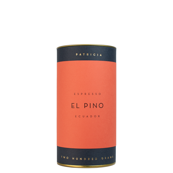 A navy blue cylinder with a red label describes the espresso coffee beans within. 'PATRICIA' and 'TWO HUNDRED GRAMS' are printed in gold foil.