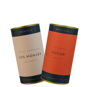 Two cylinders of Patricia espresso roasted coffee. 