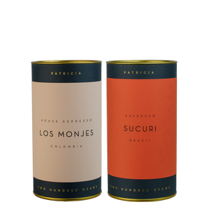 Two cylinders of Patricia espresso roasted coffee. 