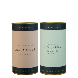 Two cylinders of Patricia espresso roasted coffee.