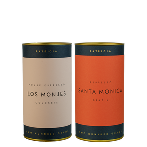 Two cylinders of Patricia espresso roasted coffee. 