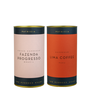Two cylinders of Patricia espresso roasted coffee.