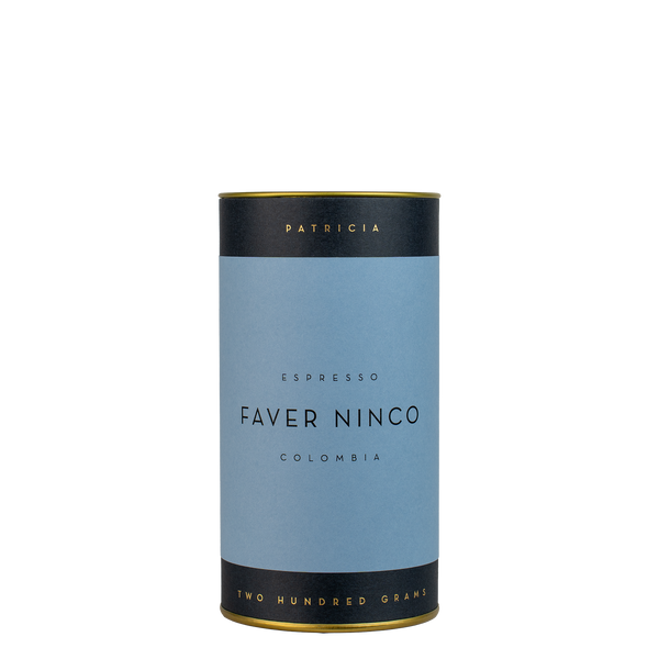 A navy blue cylinder with a blue label describes the roasted coffee beans within. 'PATRICIA' and 'TWO HUNDRED GRAMS' are printed in gold foil.