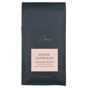 Navy blue 1kg coffee bag with a pink label that reads 'HOUSE ESPRESSO', and the Patricia logo in gold.