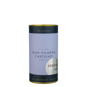 A navy blue cylinder with a purple label describes the roasted coffee beans within. 'PATRICIA' and 'TWO HUNDRED GRAMS' are printed in gold foil. A shiny round sticker reads 'SPECIAL LOT'