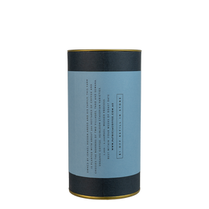 A navy blue cylinder with a blue label describes the espresso coffee beans within.