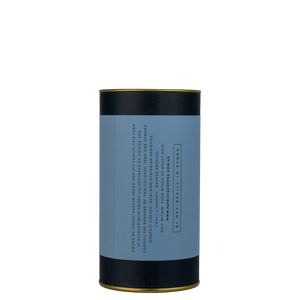 A navy blue cylinder with a blue label describes the espresso coffee beans within.