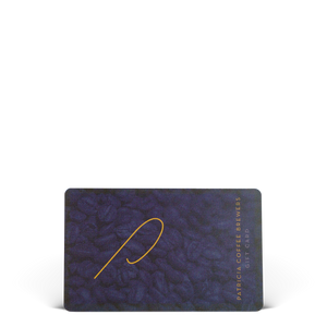 A rectangular Patricia Coffee Brewers gift card with a coffee bean background, a 'P' logo and vertical gold text on the right side.
