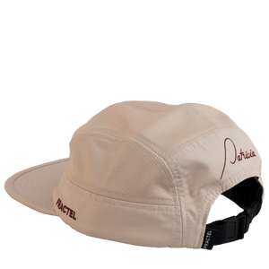 The back of a light pink running cap with the Patricia logo embroidered in maroon on the back, and Fractel on the left panel.