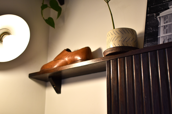 Wootten custom leather shoe above Patricia's retail coffee bean display.